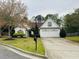 Charming single-story home featuring a two-car garage and a well-manicured front yard with mature landscaping at 2520 Legend Mill Run, Dacula, GA 30019