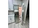 Kitchen boasts stainless steel refrigerator, white cabinets, and modern appliances at 2520 Legend Mill Run, Dacula, GA 30019