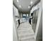 Bright kitchen equipped with stainless steel appliances, white cabinetry, and light wood floors for a modern feel at 2520 Legend Mill Run, Dacula, GA 30019
