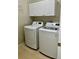 Modern laundry room featuring a washing machine and dryer for added convenience at 2520 Legend Mill Run, Dacula, GA 30019