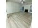 Spacious living room features tall ceilings, a fireplace, ample natural light, and light-colored floors at 2520 Legend Mill Run, Dacula, GA 30019