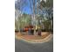 Playground with colorful play structure surrounded by a black metal fence at 2520 Legend Mill Run, Dacula, GA 30019