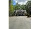 Charming pool entrance building with symmetrical design and manicured landscaping at 2520 Legend Mill Run, Dacula, GA 30019