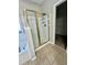 Shower with gold trim sits near the tub and next to walk-in closet at 2520 Legend Mill Run, Dacula, GA 30019
