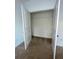 Bright walk-in closet with neutral walls, shelving, and plush carpeting at 2520 Legend Mill Run, Dacula, GA 30019