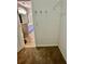 Walk-in closet with carpeted flooring and coat hooks on the wall at 2520 Legend Mill Run, Dacula, GA 30019