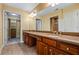 Bathroom features a double vanity with granite countertop and an open walk-in closet at 311 Ridge Hill Cir # 1, Marietta, GA 30064