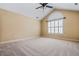Large bedroom featuring neutral carpeting, large window with custom blinds and a vaulted ceiling at 311 Ridge Hill Cir # 1, Marietta, GA 30064