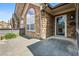 Inviting stone home entrance with an arched window and glass door, showcasing a welcoming ambiance at 311 Ridge Hill Cir # 1, Marietta, GA 30064