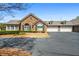 Attractive home with stone and siding, showcasing a garage and manicured landscaping, and paved driveway at 311 Ridge Hill Cir # 1, Marietta, GA 30064