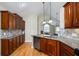 Kitchen featuring granite countertops, stainless steel appliances, hardwood floors, and cherry wood cabinetry at 311 Ridge Hill Cir # 1, Marietta, GA 30064