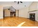 Open-concept living room with hardwood floors, a fireplace, and a seamless flow to the kitchen at 311 Ridge Hill Cir # 1, Marietta, GA 30064