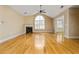 Inviting living room with gleaming hardwood floors, a cozy fireplace, and abundant natural light at 311 Ridge Hill Cir # 1, Marietta, GA 30064
