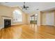 Spacious living room featuring hardwood floors, a fireplace, and a doorway leading to a sunroom at 311 Ridge Hill Cir # 1, Marietta, GA 30064