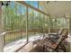 Relaxing porch features wood floors, ceiling fans, and outdoor seating for peaceful enjoyment at 3800 Macland Rd, Hiram, GA 30141
