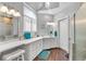 Bright bathroom featuring dual sinks, white cabinets, a separate shower, and great natural light at 3800 Macland Rd, Hiram, GA 30141