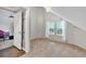 Bedroom with an opened closet with doors, carpet floors, and a ceiling fan at 3800 Macland Rd, Hiram, GA 30141
