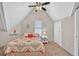 Cozy bedroom features natural light, comfortable bed, and ample closet space for peaceful rest at 3800 Macland Rd, Hiram, GA 30141