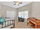 Versatile bedroom with daybed, piano, and desk provides space for rest and creativity at 3800 Macland Rd, Hiram, GA 30141