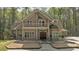 Charming two-story home with a balcony, covered porch, mature trees, and a well-manicured front yard at 3800 Macland Rd, Hiram, GA 30141