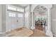 Elegant front foyer featuring tile flooring, white pillars, and views into the dining room at 3800 Macland Rd, Hiram, GA 30141