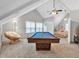 Spacious game room featuring a pool table, comfortable seating, and abundant natural light at 3800 Macland Rd, Hiram, GA 30141