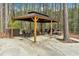 This backyard gazebo offers an inviting outdoor space with tables and chairs, perfect for relaxing or entertaining at 3800 Macland Rd, Hiram, GA 30141