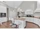 Open kitchen with island seating, stainless steel appliances, and ample cabinet space at 3800 Macland Rd, Hiram, GA 30141