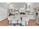Spacious kitchen boasts an island with seating, stainless steel appliances, and plenty of counter space at 3800 Macland Rd, Hiram, GA 30141