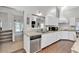 Modern kitchen featuring stainless steel appliances, granite countertops, and wood flooring at 3800 Macland Rd, Hiram, GA 30141