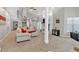 Inviting living room with fireplace, plush carpeting, and an open staircase to the second floor at 3800 Macland Rd, Hiram, GA 30141