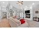Bright living room with a fireplace, high ceilings, and access to an outdoor area at 3800 Macland Rd, Hiram, GA 30141