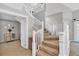 Elegant staircase with white railing and carpeted steps leading to the upper level at 3800 Macland Rd, Hiram, GA 30141