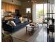 Bright, open living space featuring a comfortable couch, modern decor, and large windows with city views at 620 Glen Iris Ne Dr # 401, Atlanta, GA 30308