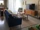 Modern living room with stylish furnishings, a large TV, and plenty of natural light at 620 Glen Iris Ne Dr # 401, Atlanta, GA 30308