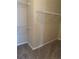 Carpeted walk-in closet featuring ample storage space with its metal shelving units at 6715 Roscommon Dr, Austell, GA 30168