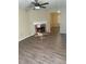 Inviting living room featuring a cozy fireplace, light walls and modern wood-look flooring at 6715 Roscommon Dr, Austell, GA 30168