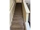 Carpeted stairway with white painted banister leading to the next level at 6715 Roscommon Dr, Austell, GA 30168