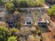 Overhead view of a property with a long driveway and surrounding land at 1070 Kirkland Rd, Covington, GA 30016