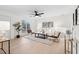 Spacious living room with contemporary furnishings, a ceiling fan, and abundant natural light at 1070 Kirkland Rd, Covington, GA 30016