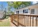 Exterior view of a home's backyard featuring a spacious wooden deck and well-manicured lawn at 1509 Stone Gate Ln, Atlanta, GA 30317