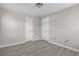 Cozy bedroom with white doors and modern gray flooring at 1509 Stone Gate Ln, Atlanta, GA 30317