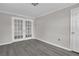 Neutral bedroom showcasing a pair of stylish French doors at 1509 Stone Gate Ln, Atlanta, GA 30317