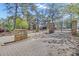 Grand gated entrance to Stonegate Cottages with stone pillars and brick-paved driveway at 1509 Stone Gate Ln, Atlanta, GA 30317