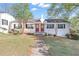 Charming duplex-style home with a well-maintained lawn and mature trees at 1509 Stone Gate Ln, Atlanta, GA 30317