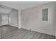 Light-gray floors and walls fill this room with natural light from a door and window at 1509 Stone Gate Ln, Atlanta, GA 30317