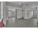 Spacious living room with gray walls and hardwood-style floors bathed in natural light at 1509 Stone Gate Ln, Atlanta, GA 30317