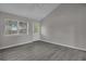 Well-lit living room with new flooring, a window, a ceiling fan, and fresh paint at 1509 Stone Gate Ln, Atlanta, GA 30317