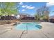 A community pool with stone waterfall feature and surrounding landscaping at 1509 Stone Gate Ln, Atlanta, GA 30317