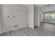 An incomplete room, with hardwood-style floors and gray walls at 1509 Stone Gate Ln, Atlanta, GA 30317